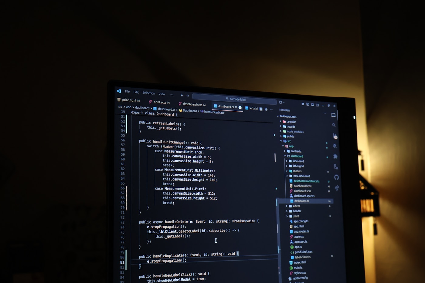 A developer working with AI-assisted code on a laptop.
