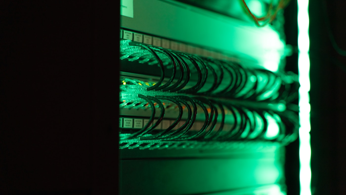 A row of equipment racks in a data center cooling aisle.